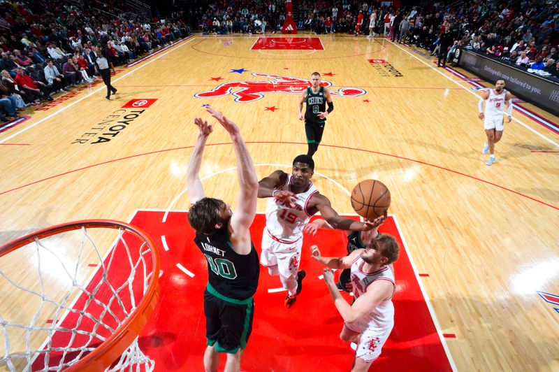 HOUSTON, TX - JANUARY 21: Nate Williams #19 of the Houston Rockets drives to the basket during the game against the Boston Celtics on January 21, 2024 at the Toyota Center in Houston, Texas. NOTE TO USER: User expressly acknowledges and agrees that, by downloading and or using this photograph, User is consenting to the terms and conditions of the Getty Images License Agreement. Mandatory Copyright Notice: Copyright 2024 NBAE (Photo by Logan Riely/NBAE via Getty Images)