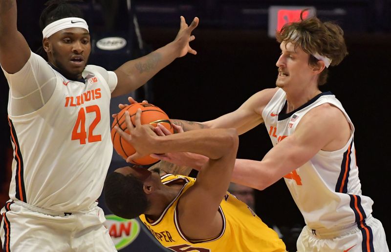 Feb 20, 2023; Champaign, Illinois, USA;  Illinois Fighting Illini forward Dain Dainja (42) and Matthew Mayer (24) pressure Minnesota Golden Gophers guard Ta'lon Cooper (55) during the first half at State Farm Center. Mandatory Credit: Ron Johnson-USA TODAY Sports