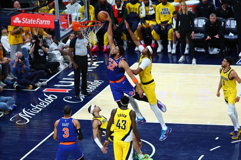 INDIANAPOLIS, IN - MAY 25:  Karl-Anthony Towns #32 of the New York Knicks dunks the ball during the game against the Indiana Pacers  during Game 3 of the 2025 Eastern Conference Finals on May 25, 2025 at Gainbridge Fieldhouse in Indianapolis, Indiana. NOTE TO USER: User expressly acknowledges and agrees that, by downloading and or using this Photograph, user is consenting to the terms and conditions of the Getty Images License Agreement. Mandatory Copyright Notice: Copyright 2025 NBAE (Photo by David L. Nemec/NBAE via Getty Images)