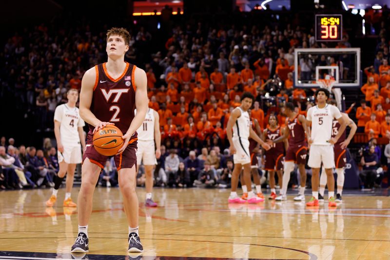 Feb 1, 2025; Charlottesville, Virginia, USA; Virginia Tech Hokies guard Jaden Schutt (2) takes a foul shot as the Virginia Cavaliers look on during the first half at John Paul Jones Arena. Mandatory Credit: Amber Searls-Imagn Images