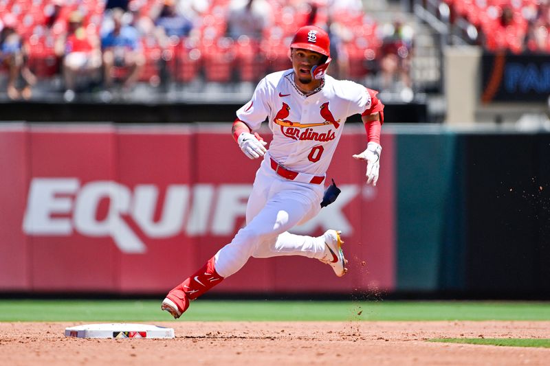 Jun 13, 2024; St. Louis, Missouri, USA;  St. Louis Cardinals shortstop Masyn Winn (0) rounds second base and runs to third for a triple against the Pittsburgh Pirates during the third inning at Busch Stadium. Mandatory Credit: Jeff Curry-USA TODAY Sports