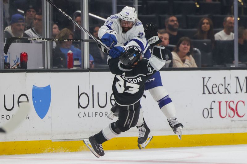 Mar 23, 2024; Los Angeles, California, USA; Tampa Bay Lighting center Michael Eyssimont (23) checks Los Angeles Kings right wing Viktor Arvidsson (33) during the third period of an NHL hockey game at Crypto.com Arena. Mandatory Credit: Yannick Peterhans-USA TODAY Sports