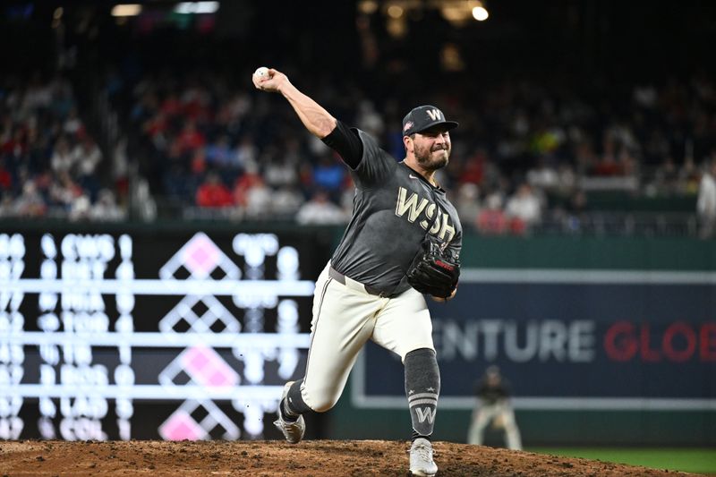 Sep 27, 2024; Washington, District of Columbia, USA;  Washington Nationals pitcher Tanner Rainey (21) throws a pitch during the eighth inning against the Philadelphia Phillies at Nationals Park. Mandatory Credit: James A. Pittman-Imagn Images