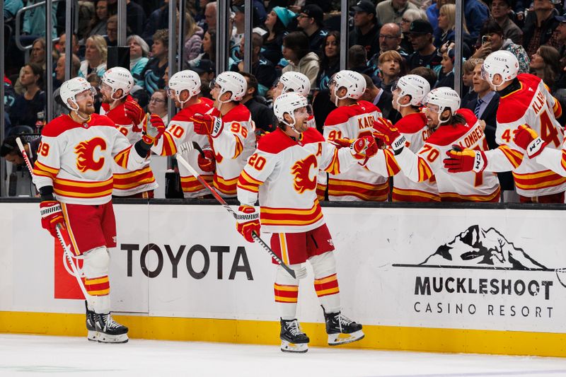 Oct 19, 2024; Seattle, Washington, USA; Calgary Flames center Blake Coleman (20) celebrates with teammates after scoring a goal against the Seattle Kraken during the first period at Climate Pledge Arena. Mandatory Credit: Caean Couto-Imagn Images