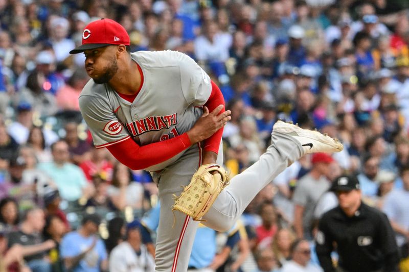 Jun 14, 2024; Milwaukee, Wisconsin, USA; Cincinnati Reds starting pitcher Hunter Greene (21) pitches against the Milwaukee Brewers in the first inning at American Family Field. Mandatory Credit: Benny Sieu-USA TODAY Sports