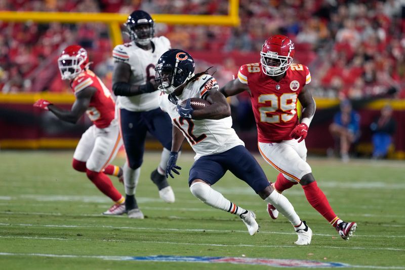 Chicago Bears wide receiver Velus Jones Jr., (12) runs for a touchdown as Kansas City Chiefs linebacker Curtis Jacobs (29) defends during the second half of an NFL preseason football game Thursday, Aug. 22, 2024, in Kansas City, Mo. (AP Photo/Ed Zurga)