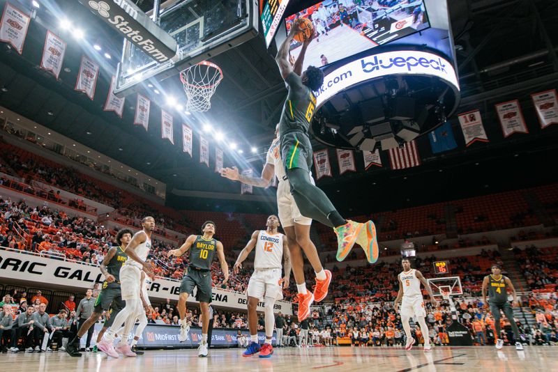 Jan 6, 2024; Stillwater, Oklahoma, USA; Baylor Bears forward Josh Ojianwuna (15) goes up for a shot around Oklahoma State Cowboys forward Eric Dailey Jr. (2) during the second half at Gallagher-Iba Arena. Mandatory Credit: William Purnell-USA TODAY Sports