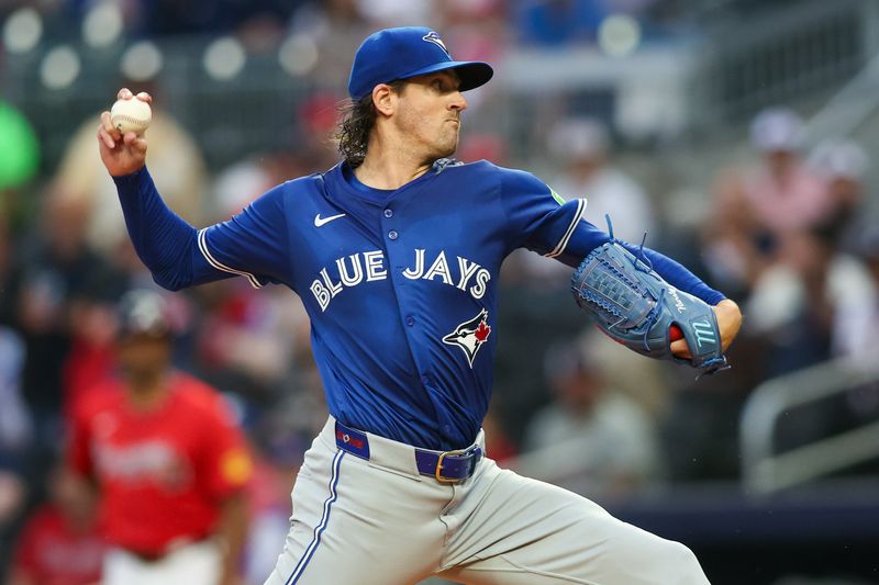 Sep 6, 2024; Atlanta, Georgia, USA; Toronto Blue Jays starting pitcher Kevin Gausman (34) throws against the Atlanta Braves in the first inning at Truist Park. Mandatory Credit: Brett Davis-Imagn Images