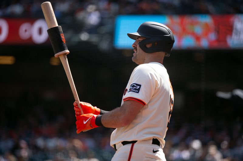 May 18, 2024; San Francisco, California, USA; San Francisco Giants catcher Curt Casali (18) waits on deck during the sixth inning against the Colorado Rockies at Oracle Park. Mandatory Credit: D. Ross Cameron-USA TODAY Sports