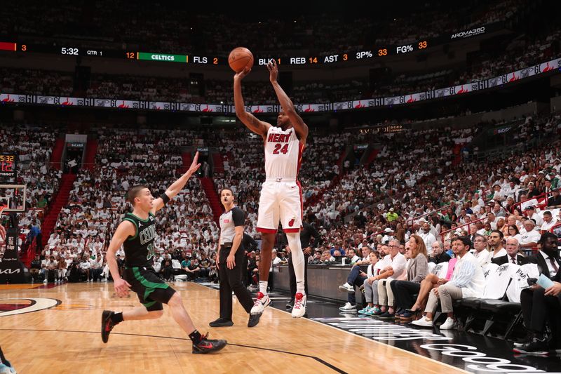 MIAMI, FL - APRIL 27: Haywood Highsmith #24 of the Miami Heat shoots a three point basket during the game against the Boston Celtics during Round 1 Game 3 of the 2024 NBA Playoffs on April 27, 2024 at Kaseya Center in Miami, Florida. NOTE TO USER: User expressly acknowledges and agrees that, by downloading and or using this Photograph, user is consenting to the terms and conditions of the Getty Images License Agreement. Mandatory Copyright Notice: Copyright 2024 NBAE (Photo by Issac Baldizon/NBAE via Getty Images)