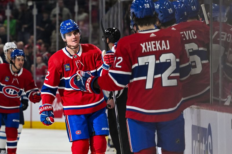 Oct 28, 2023; Montreal, Quebec, CAN; Montreal Canadiens defenseman Justin Barron (52) celebrates his goal against the Winnipeg Jets with his teammates at the bench during the first period at Bell Centre. Mandatory Credit: David Kirouac-USA TODAY Sports