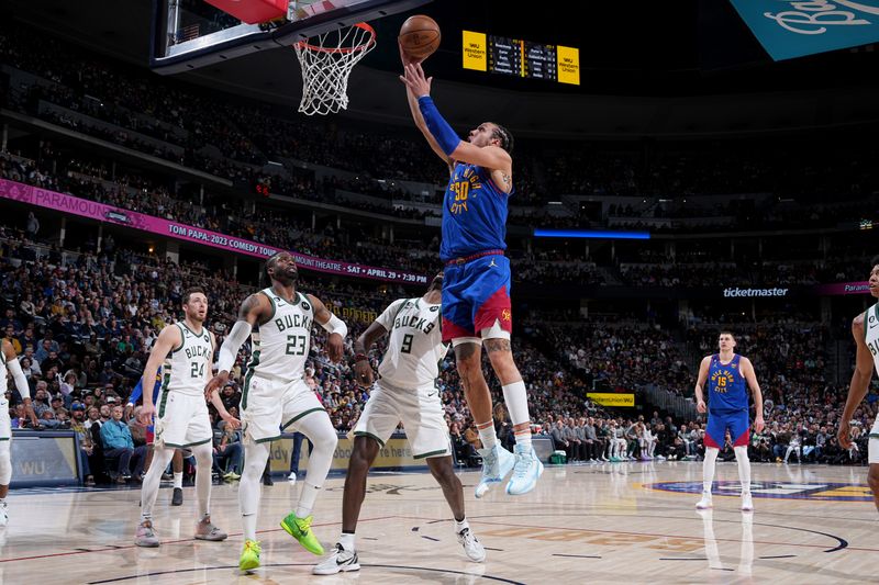 DENVER, CO - MARCH 25: Aaron Gordon #50 of the Denver Nuggets drives to the basket during the game against the Milwaukee Bucks on March 25, 2023 at the Ball Arena in Denver, Colorado. NOTE TO USER: User expressly acknowledges and agrees that, by downloading and/or using this Photograph, user is consenting to the terms and conditions of the Getty Images License Agreement. Mandatory Copyright Notice: Copyright 2023 NBAE (Photo by Garrett Ellwood/NBAE via Getty Images)