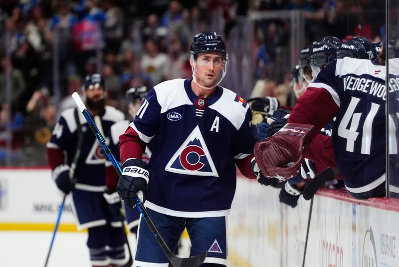 Jan 16, 2026; Denver, Colorado, USA; Colorado Avalanche center Brock Nelson (11) celebrates his first goal of the first period against the Nashville Predators at Ball Arena. Mandatory Credit: Ron Chenoy-Imagn Images