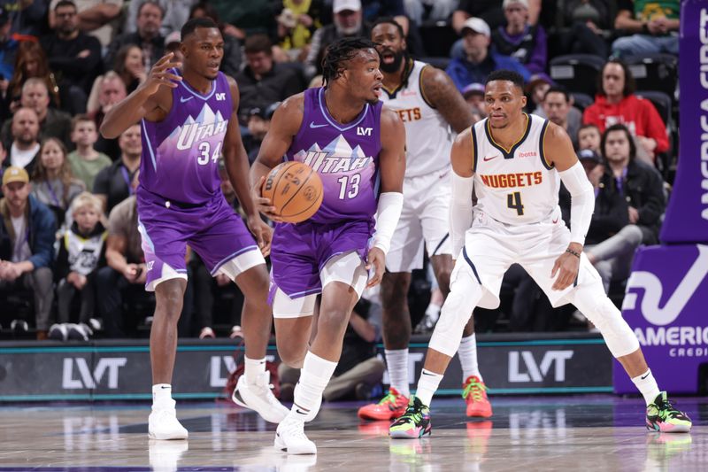 SALT LAKE CITY, UT - WEDNESDAY 27: Isaiah Collier #13 of the Utah Jazz looks to pass the ball during the game against the Denver Nuggets on Wednesday 27, 2024 at vivint.SmartHome Arena in Salt Lake City, Utah. NOTE TO USER: User expressly acknowledges and agrees that, by downloading and or using this Photograph, User is consenting to the terms and conditions of the Getty Images License Agreement. Mandatory Copyright Notice: Copyright 2024 NBAE (Photo by Melissa Majchrzak/NBAE via Getty Images)