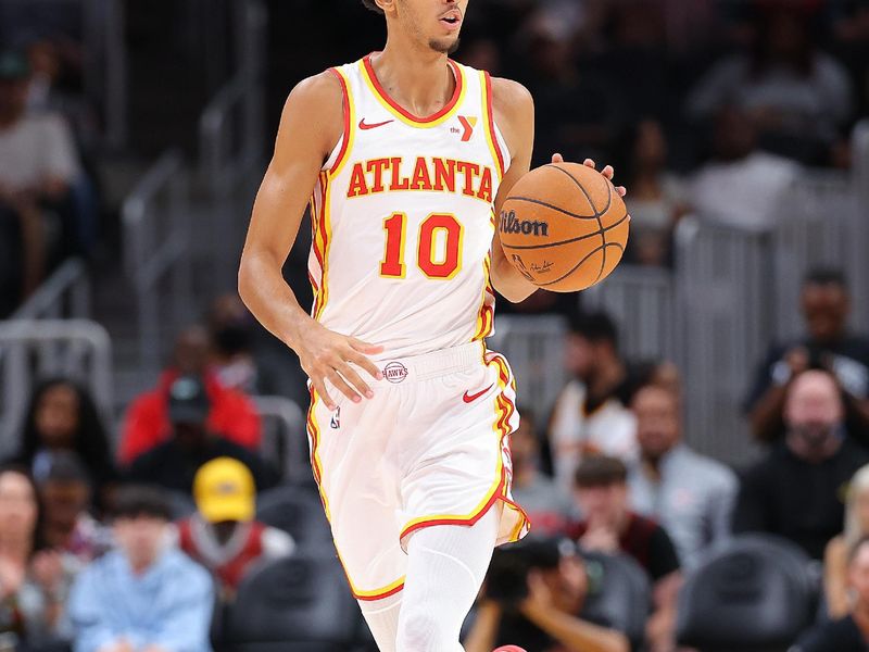 ATLANTA, GEORGIA - OCTOBER 08:  Zaccharie Risacher #10 of the Atlanta Hawks pushes the ball down the court against the Indiana Pacers during the first quarter at State Farm Arena on October 08, 2024 in Atlanta, Georgia.  NOTE TO USER: User expressly acknowledges and agrees that, by downloading and/or using this photograph, user is consenting to the terms and conditions of the Getty Images License Agreement.  (Photo by Kevin C. Cox/Getty Images)