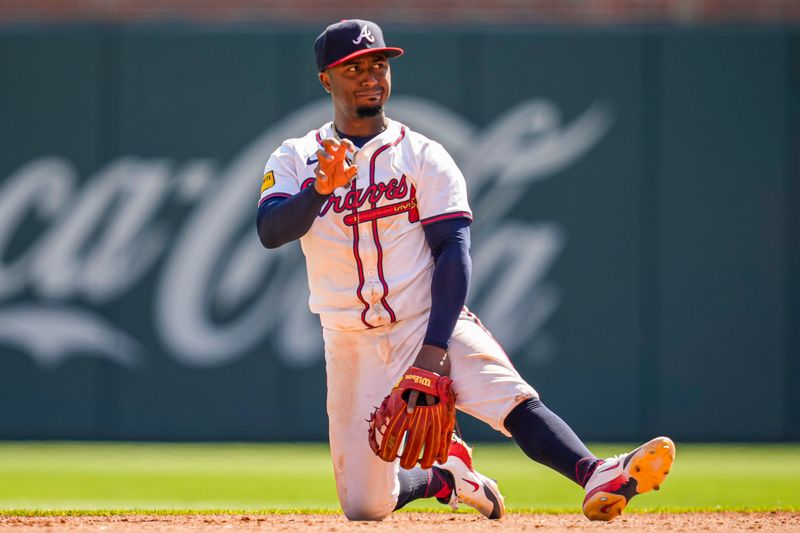 Apr 7, 2024; Cumberland, Georgia, USA; Atlanta Braves second baseman Ozzie Albies (1) gestures after throwing for a force out against the Arizona Diamondbacks during the ninth inning at Truist Park. Mandatory Credit: Dale Zanine-USA TODAY Sports