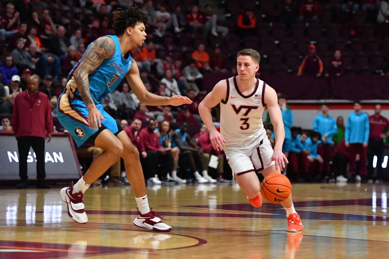 Feb 13, 2024; Blacksburg, Virginia, USA; Virginia Tech Hokies guard Sean Pedulla (3) drives toward the basket while being defended by Florida State Seminoles forward Cam Corhen (3) during the second half at Cassell Coliseum. Mandatory Credit: Brian Bishop-USA TODAY Sports