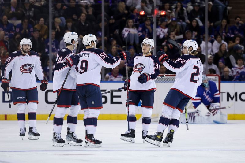 Oct 23, 2022; New York, New York, USA;  Columbus Blue Jackets right wing Yegor Chinakhov (59) celebrates with Columbus Blue Jackets center Cole Sillinger (34), Columbus Blue Jackets defenseman Jake Bean (22), and additional teammates after scoring a goal against New York Rangers goaltender Jaroslav Halak (41) during the second period at Madison Square Garden. Mandatory Credit: Jessica Alcheh-USA TODAY Sports