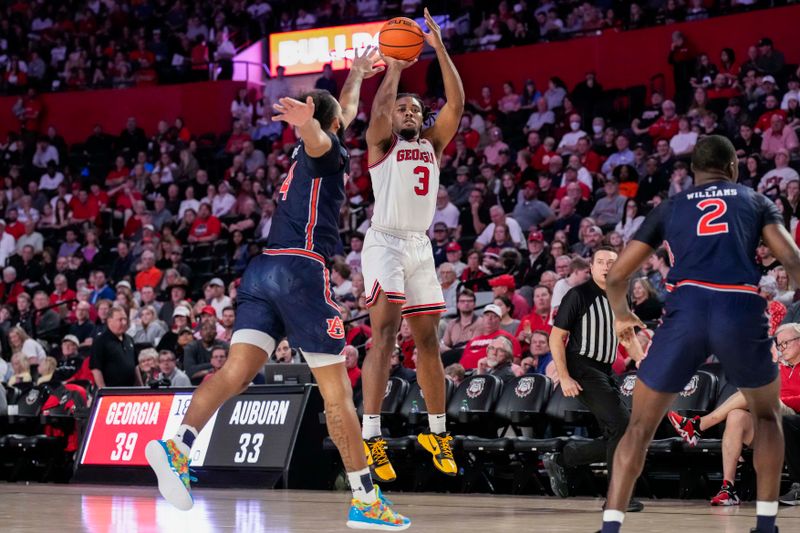 Jan 4, 2023; Athens, Georgia, USA; Georgia Bulldogs guard Kario Oquendo (3) shoots a three point shot against the Auburn Tigers during the second half at Stegeman Coliseum. Mandatory Credit: Dale Zanine-USA TODAY Sports