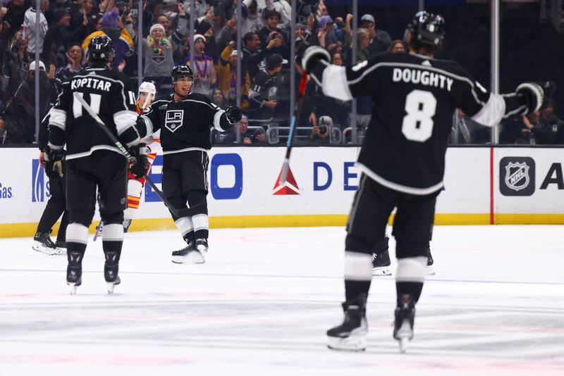 Dec 23, 2023; Los Angeles, California, USA; Los Angeles Kings right wing Quinton Byfield (55) celebrates after scoring a goal against the Calgary Flames during the third period of a game at Crypto.com Arena. Mandatory Credit: Jessica Alcheh-USA TODAY Sports