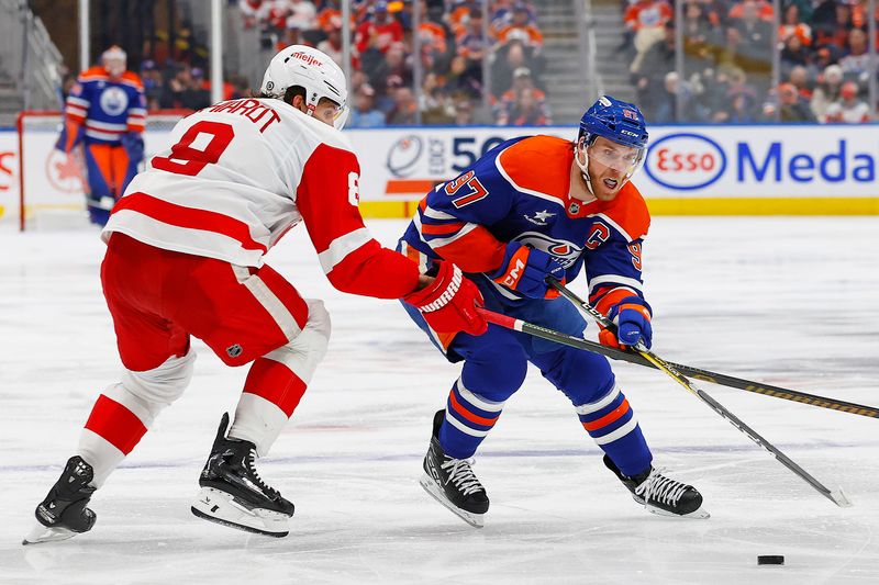 Jan 30, 2025; Edmonton, Alberta, CAN; Edmonton Oilers forward Connor McDavid (97) tries to carry the puck around Detroit Red Wings defensemen Ben Chiarot (8) during the third period at Rogers Place. Mandatory Credit: Perry Nelson-Imagn Images