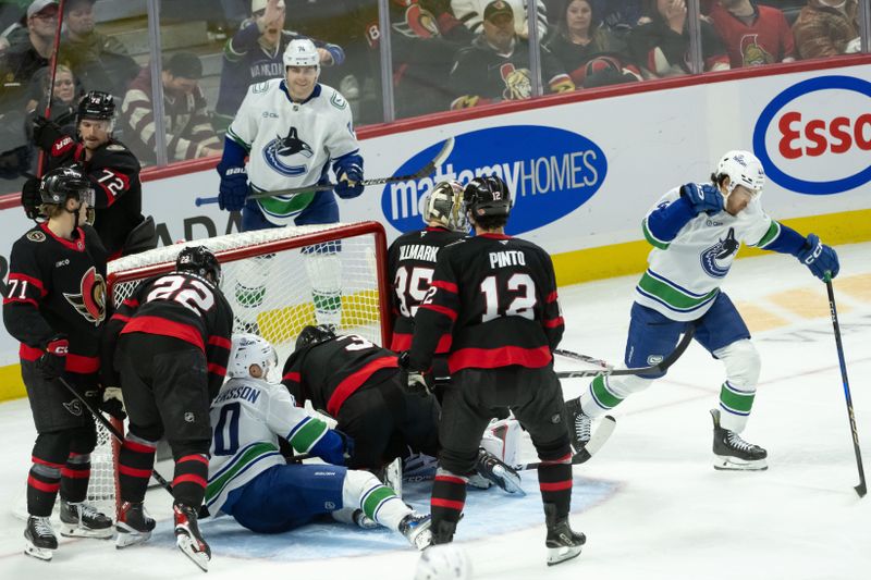 Nov 23, 2024; Ottawa, Ontario, CAN; Vancouver Canucks left wing Kiefer Sherwood (44) celebrates his goal scored against Ottawa Senators goalie Linus Ullmark (35) in the third period at the Canadian Tire Centre. Mandatory Credit: Marc DesRosiers-Imagn Images