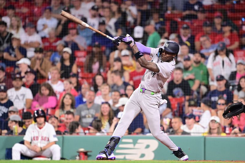 Jul 28, 2024; Boston, Massachusetts, USA; New York Yankees center fielder Jazz Chisholm Jr (13) hits a single against the Boston Red Sox during the ninth inning at Fenway Park. Mandatory Credit: Eric Canha-USA TODAY Sports