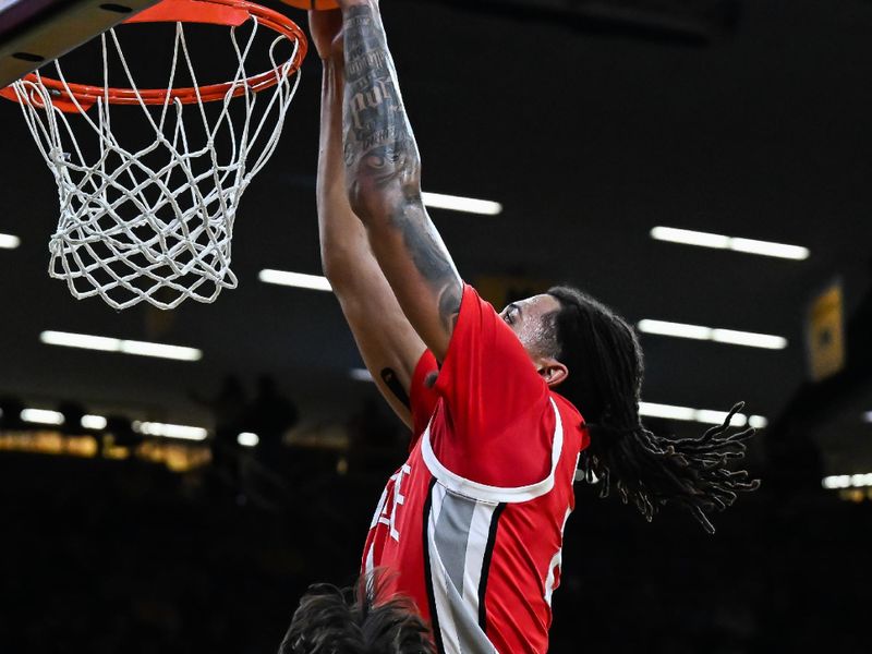 Feb 25, 2026; Iowa City, Iowa, USA; Ohio State Buckeyes forward Devin Royal (21) goes to the basket as Iowa Hawkeyes guard Tate Sage (24) defends during the first half at Carver-Hawkeye Arena. Mandatory Credit: Jeffrey Becker-Imagn Images