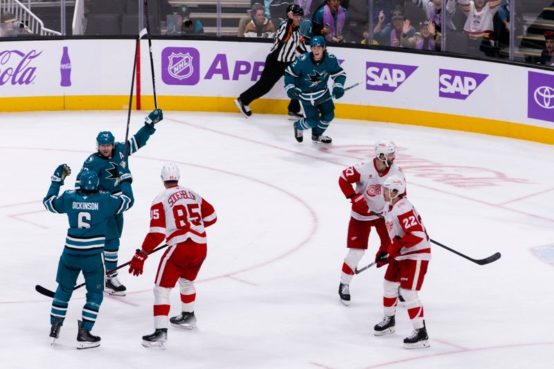 Nov 2, 2025; San Jose, California, USA;  San Jose Sharks defenseman Sam Dickinson (6) celebrates with other players after he scored goal against the Detroit Red Wings during the third period at SAP Center at San Jose. Mandatory Credit: John Hefti-Imagn Images