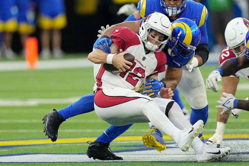 Arizona Cardinals quarterback Colt McCoy (12) is sacked by Los Angeles Rams linebacker Leonard Floyd during the second half of an NFL football game Sunday, Nov. 13, 2022, in Inglewood, Calif. (AP Photo/Mark J. Terrill)