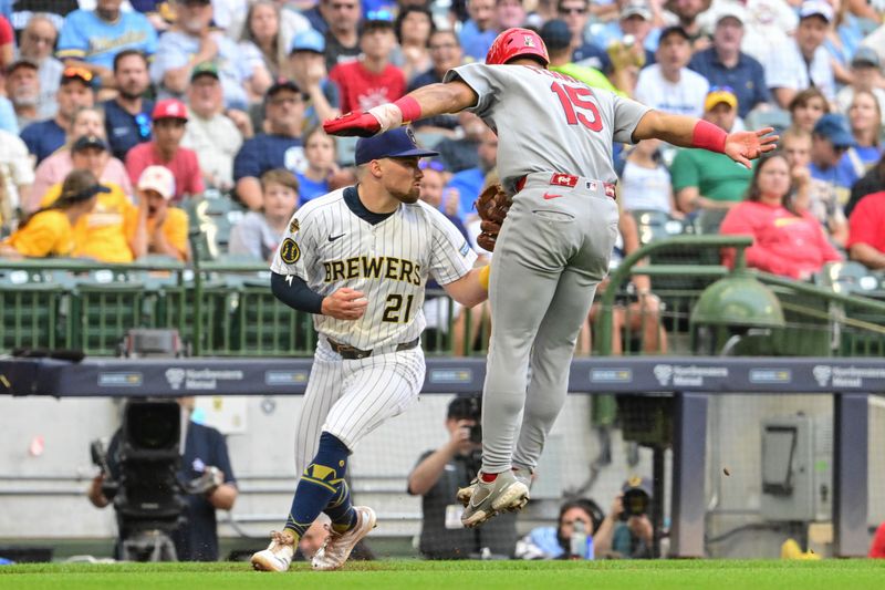 Sep 14, 2025; Milwaukee, Wisconsin, USA;  Milwaukee Brewers third baseman Caleb Durbin (21) tags out St. Louis Cardinals second baseman Jose Fermin (15) trying to steal home in the third inning at American Family Field. Mandatory Credit: Benny Sieu-Imagn Images
