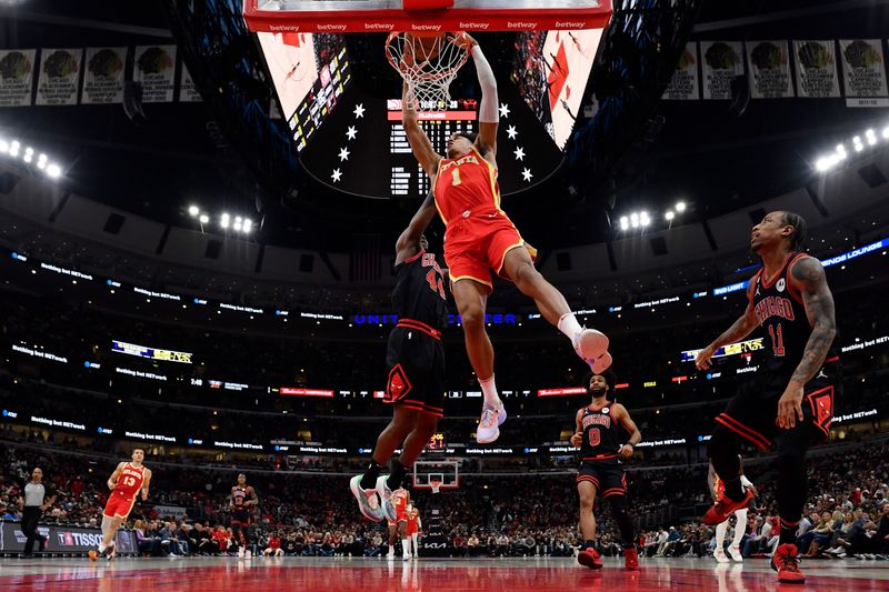 CHICAGO, ILLINOIS - APRIL 04: Jalen Johnson #1 of the Atlanta Hawks dunks against the Chicago Bulls at United Center on April 04, 2023 in Chicago, Illinois. NOTE TO USER: User expressly acknowledges and agrees that, by downloading and or using this photograph, User is consenting to the terms and conditions of the Getty Images License Agreement.  (Photo by Quinn Harris/Getty Images)