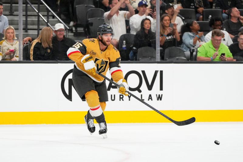 Oct 9, 2024; Las Vegas, Nevada, USA; Vegas Golden Knights defenseman Noah Hanifin (15) passes the puck during the first period against the Colorado Avalanche at T-Mobile Arena. Mandatory Credit: Lucas Peltier-Imagn Images