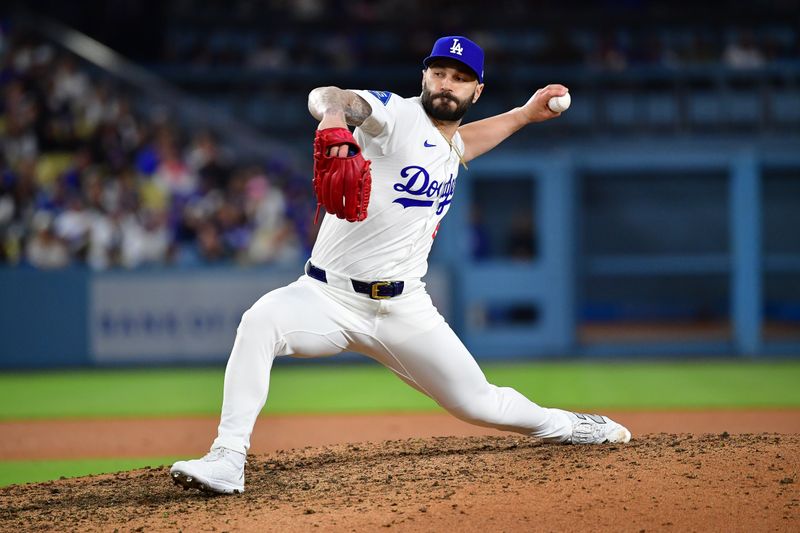 June 3, 2025; Los Angeles, California, USA; Los Angeles Dodgers pitcher Tanner Scott (66) throws against the New York Mets during the tenth inning at Dodger Stadium. Mandatory Credit: Gary A. Vasquez-Imagn Images