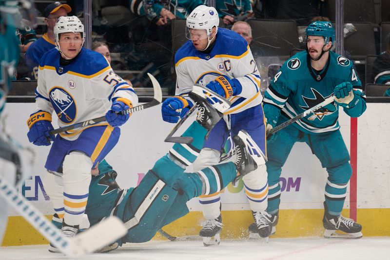 Jan 27, 2024; San Jose, California, USA; Buffalo Sabres right wing Kyle Okposo (21) checks San Jose Sharks defenseman Ty Emberson (6) to the ice during the third period at SAP Center at San Jose. Mandatory Credit: Robert Edwards-USA TODAY Sports