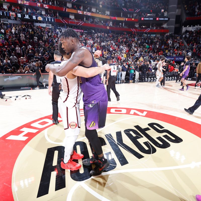 HOUSTON, TX - JANUARY 5:   Fred VanVleet #5 of the Houston Rockets and Dorian Finney-Smith #17 of the Los Angeles Lakers embrace after the game on January 5, 2025 at the Toyota Center in Houston, Texas. NOTE TO USER: User expressly acknowledges and agrees that, by downloading and or using this photograph, User is consenting to the terms and conditions of the Getty Images License Agreement. Mandatory Copyright Notice: Copyright 2025 NBAE (Photo by Logan Riely/NBAE via Getty Images)