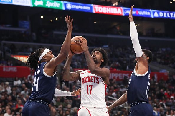 LOS ANGELES, CALIFORNIA - NOVEMBER 17: Tari Eason #17 of the Houston Rockets goes to the basket defended by Terance Mann #14 and Paul George #13 of the Los Angeles Clippers in the second quarter of an NBA In-Season Tournament game at Crypto.com Arena on November 17, 2023 in Los Angeles, California. NOTE TO USER: User expressly acknowledges and agrees that, by downloading and or using this photograph, User is consenting to the terms and conditions of the Getty Images License Agreement. (Photo by Meg Oliphant/Getty Images)