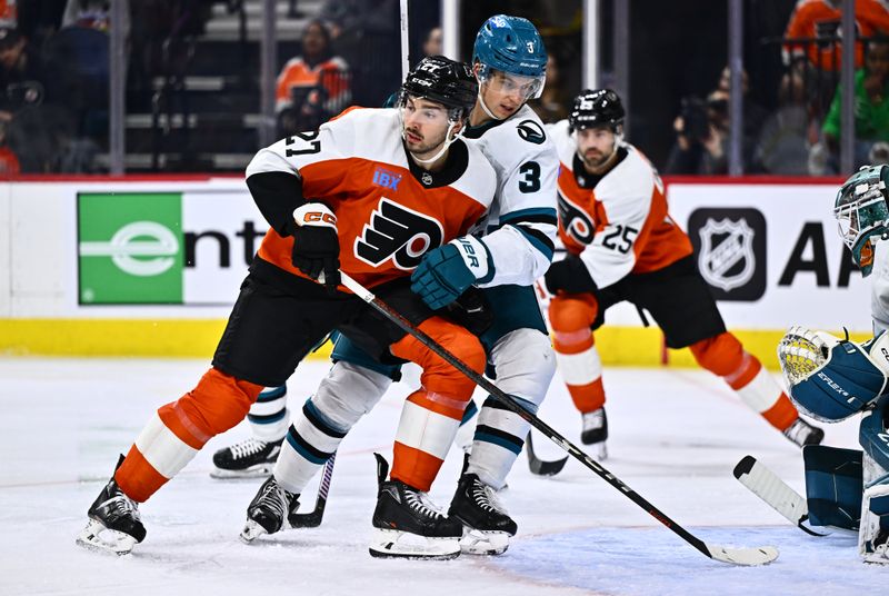 Mar 12, 2024; Philadelphia, Pennsylvania, USA; Philadelphia Flyers left wing Noah Cates (27) skates against San Jose Sharks defenseman Henry Thrun (3) in the third period at Wells Fargo Center. Mandatory Credit: Kyle Ross-USA TODAY Sports