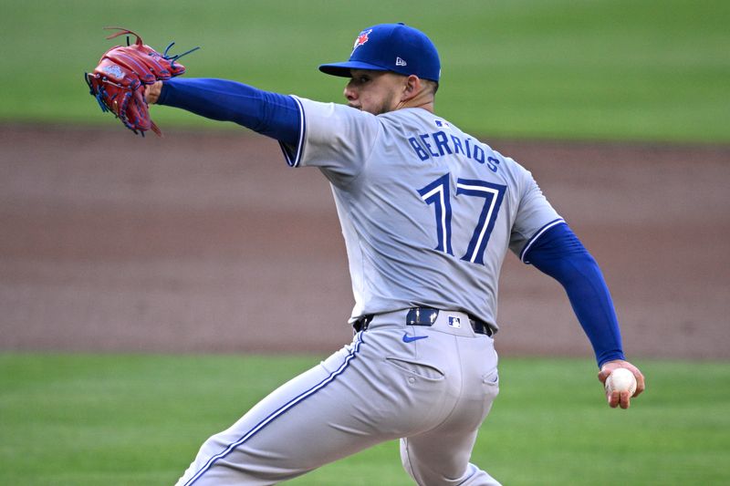 Apr 20, 2024; San Diego, California, USA; Toronto Blue Jays starting pitcher Jose Berrios (17) throws a pitch against the San Diego Padres during the first inning at Petco Park. Mandatory Credit: Orlando Ramirez-USA TODAY Sports