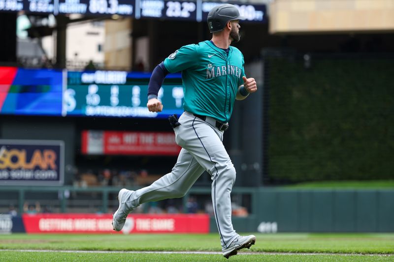 May 9, 2024; Minneapolis, Minnesota, USA; Seattle Mariners Mitch Haniger (17) scores on a single hit by Luke Raley (20) during the second inning against the Minnesota Twins at Target Field. Mandatory Credit: Matt Krohn-USA TODAY Sports