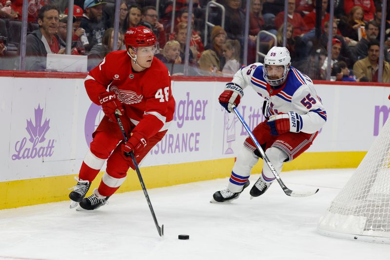 Nov 9, 2024; Detroit, Michigan, USA;  Detroit Red Wings right wing Jonatan Berggren (48) skates with the puck against the New York Rangers in the second period at Little Caesars Arena. Mandatory Credit: Rick Osentoski-Imagn Images