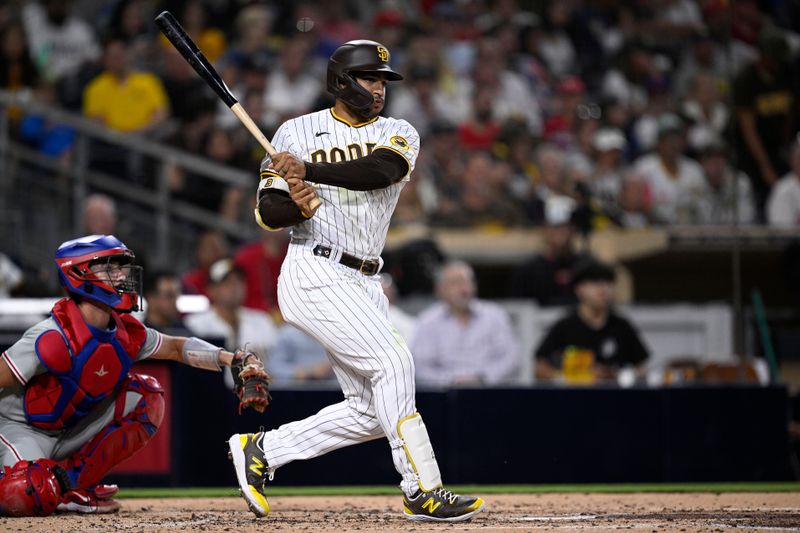 Sep 5, 2023; San Diego, California, USA; San Diego Padres center fielder Trent Grisham (1) hits a double against the Philadelphia Phillies during the third inning at Petco Park. Mandatory Credit: Orlando Ramirez-USA TODAY Sports