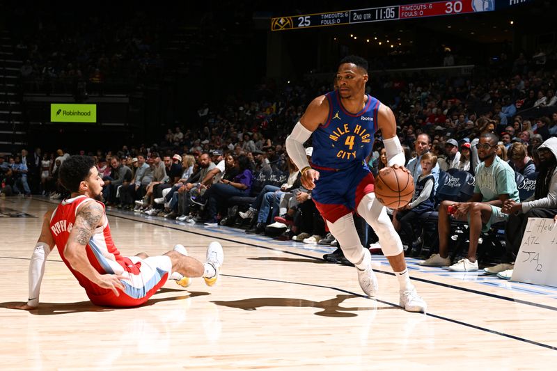 MEMPHIS, TN - NOVEMBER 17: Russell Westbrook #4 of the Denver Nuggets dribbles the ball during the game against the Memphis Grizzlies during a regular season game on November 17, 2024 at FedExForum in Memphis, Tennessee. NOTE TO USER: User expressly acknowledges and agrees that, by downloading and or using this photograph, User is consenting to the terms and conditions of the Getty Images License Agreement. Mandatory Copyright Notice: Copyright 2024 NBAE (Photo by Grant Burke/NBAE via Getty Images)