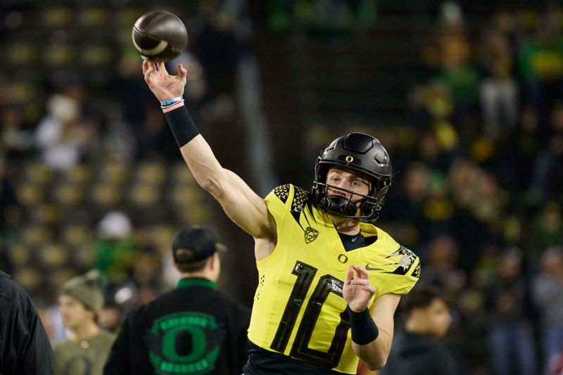 Nov 11, 2023; Eugene, Oregon, USA; Oregon Ducks quarterback Bo Nix (10) warms up before a game against the USC Trojans at Autzen Stadium. Mandatory Credit: Troy Wayrynen-USA TODAY Sports