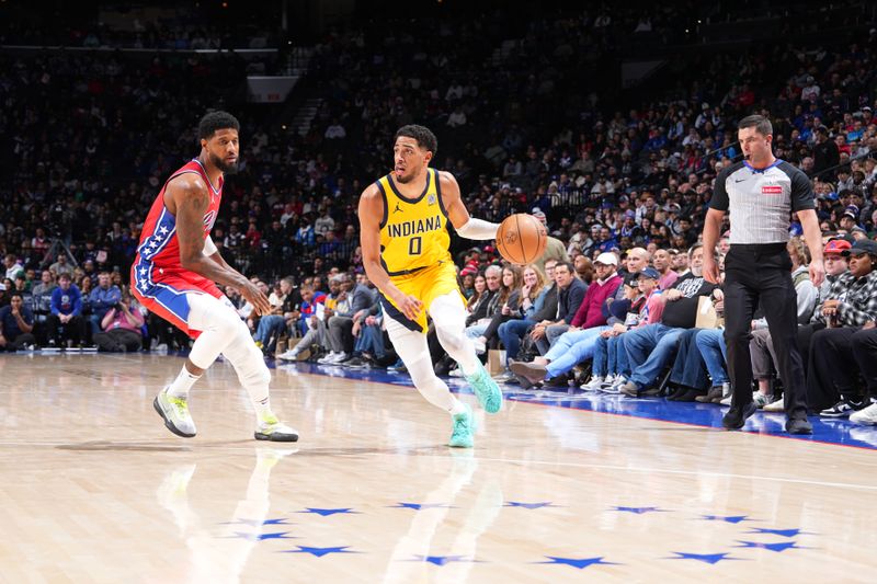 PHILADELPHIA, PA - DECEMBER 13: Tyrese Haliburton #0 of the Indiana Pacers drives to the basket during the game against the Philadelphia 76ers on December 13, 2024 at the Wells Fargo Center in Philadelphia, Pennsylvania NOTE TO USER: User expressly acknowledges and agrees that, by downloading and/or using this Photograph, user is consenting to the terms and conditions of the Getty Images License Agreement. Mandatory Copyright Notice: Copyright 2024 NBAE (Photo by Jesse D. Garrabrant/NBAE via Getty Images)