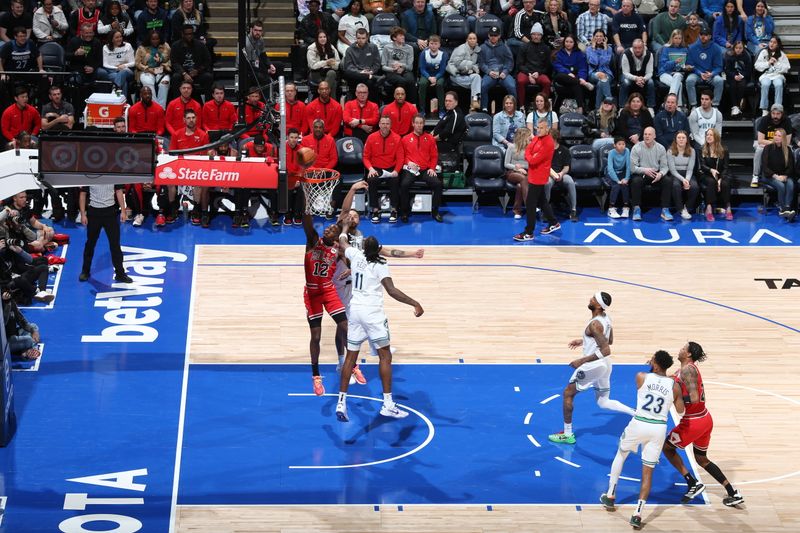 MINNEAPOLIS, MN -  MARCH 31: Ayo Dosunmu #12 of the Chicago Bulls drives to the basket during the game against the Minnesota Timberwolves on March 31, 2024 at Target Center in Minneapolis, Minnesota. NOTE TO USER: User expressly acknowledges and agrees that, by downloading and or using this Photograph, user is consenting to the terms and conditions of the Getty Images License Agreement. Mandatory Copyright Notice: Copyright 2024 NBAE (Photo by David Sherman/NBAE via Getty Images)