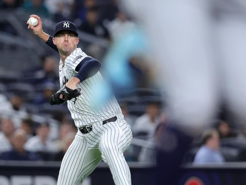 May 20, 2024; Bronx, New York, USA; New York Yankees relief pitcher Clay Holmes (35) throws to first but Seattle Mariners center fielder Julio Rodriguez (44) beats the throw for an infield single during the ninth inning at Yankee Stadium. Mandatory Credit: Brad Penner-USA TODAY Sports