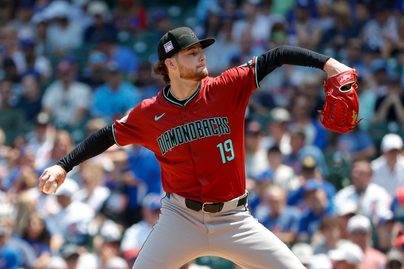 Jul 19, 2024; Chicago, Illinois, USA; Arizona Diamondbacks starting pitcher Ryne Nelson (19) delivers a pitch against the Chicago Cubs during the first inning at Wrigley Field. Mandatory Credit: Kamil Krzaczynski-USA TODAY Sports