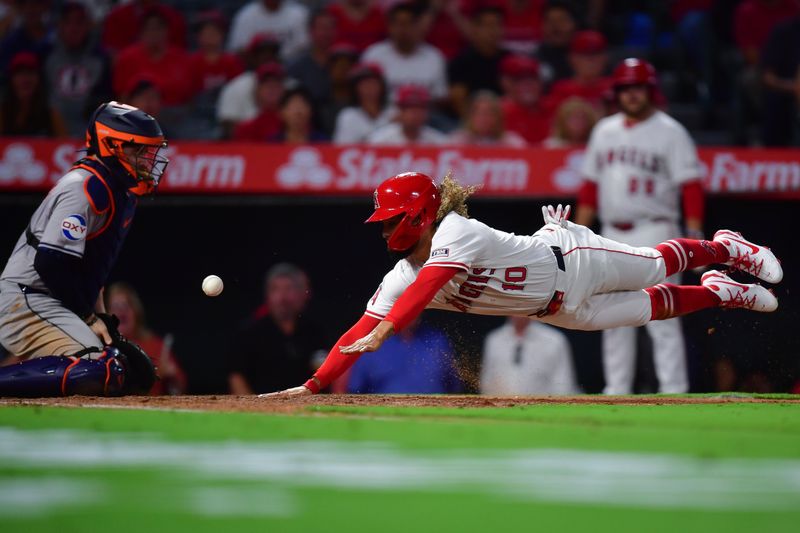 Sep 13, 2024; Anaheim, California, USA; Los Angeles Angels second baseman Jack Lopez (10) scores a run against the Houston Astros during the third inning at Angel Stadium. Mandatory Credit: Gary A. Vasquez-Imagn Images