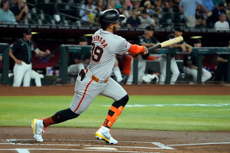 Jun 5, 2024; Phoenix, Arizona, USA; San Francisco Giants second base Thairo Estrada (39) hits a single against the Arizona Diamondbacks in the first inning at Chase Field. Mandatory Credit: Rick Scuteri-USA TODAY Sports